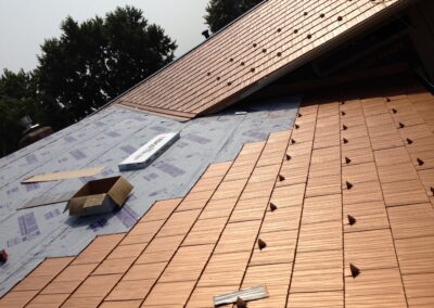 installation of copper colored steel shake metal shingle roof