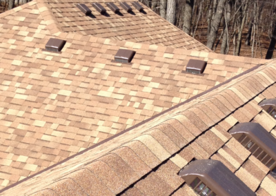 ridgeline of brown roof with new roof vents