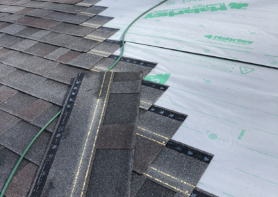 installation of new grey shingles using Malarkey products