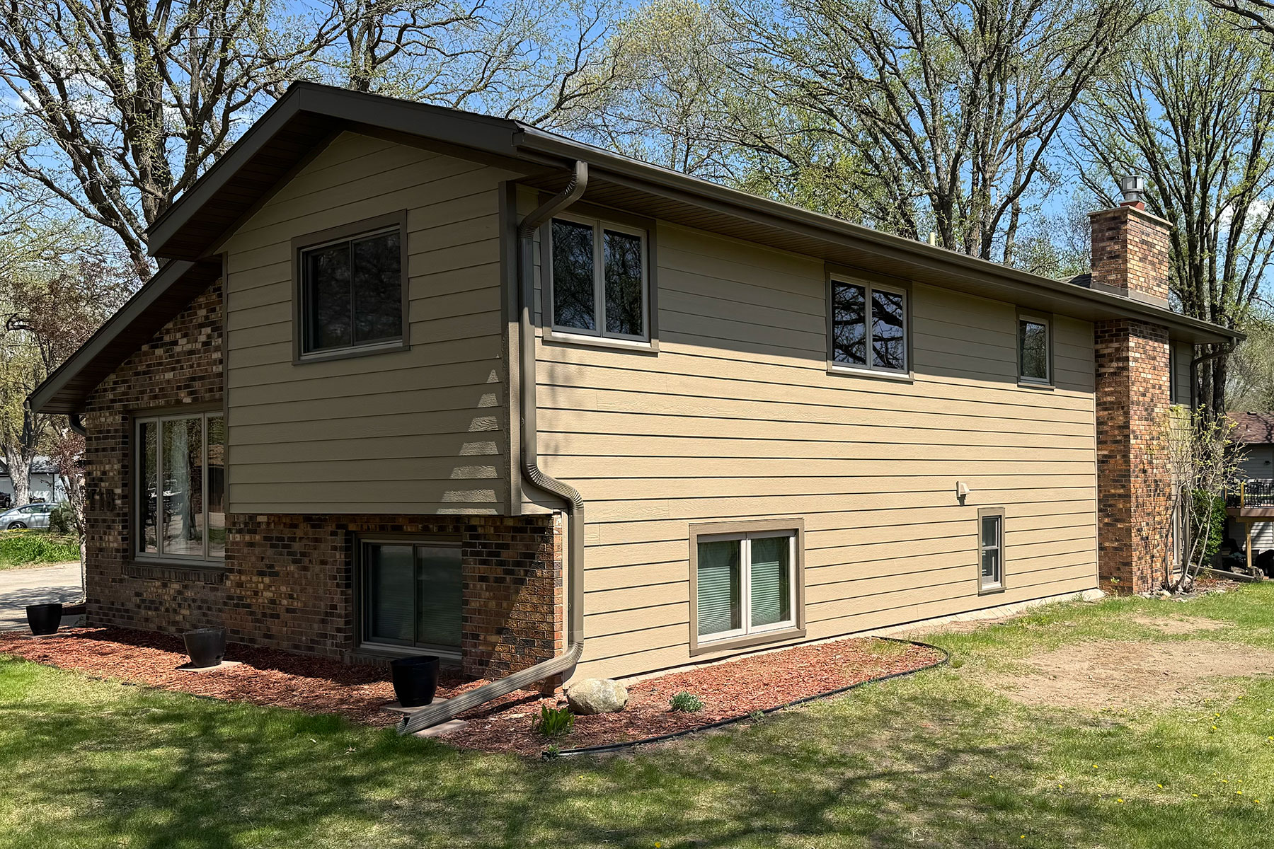 After Photo of Home Exterior with new roofing, siding, and gutters