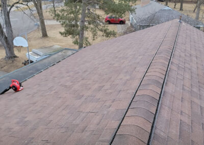 new roofing ridgeline with ventilation on brown roof