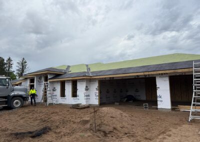 photo of a new home being built with the exterior being worked on