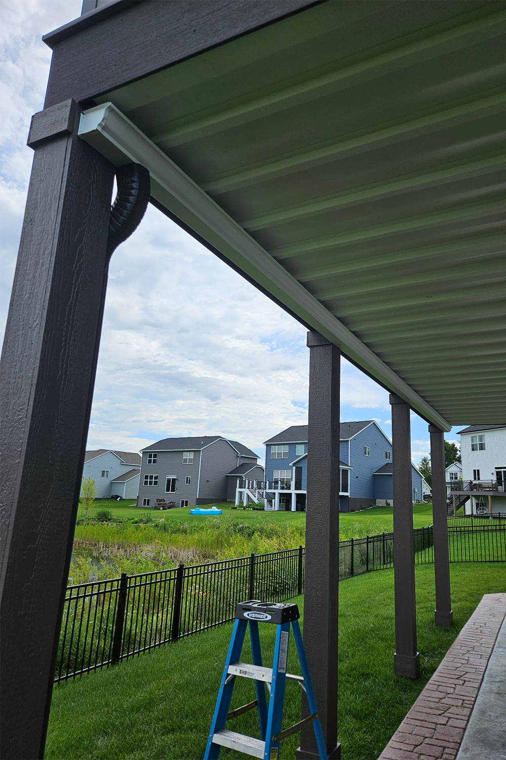 gutter system on underside of deck for water protection